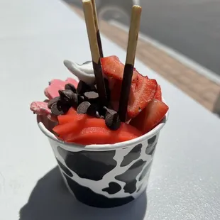 Watermelon with tart yogurt. Added  pocky, strawberries, circus animal cookies and chocolate chips. So good! Also how cute is the cup!