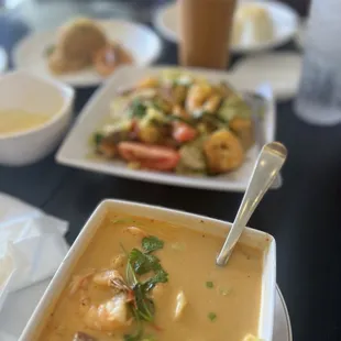 a bowl of soup and a plate of food