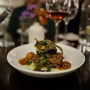 STRIPED BASS CHERMOULA: green garbanzo, zucchini latke, blistered tomato, on my, so good