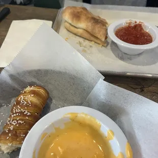 Pretzel stick with delicious beer cheese! Boli with dipping sauce.
