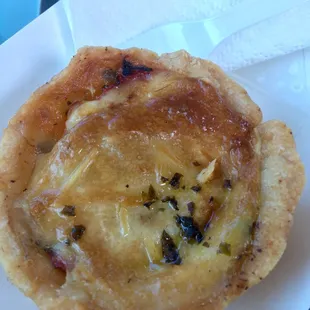 The tomato hand tart, warmed served with a napkin and fork