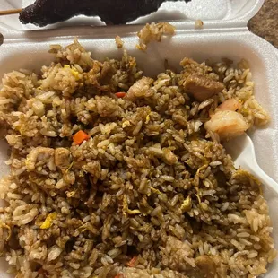 a takeout container with rice and meat
