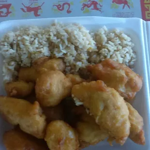 a takeout box of chinese food