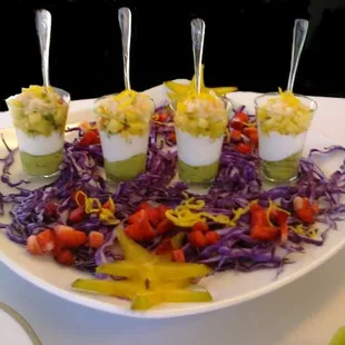 Mango Pineapple Salsa with Avocado Puree, Citrus Crema and Chilled Cod Ceviche with Fresh Star Fruit Garnish