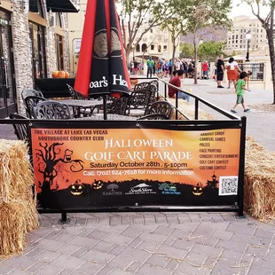 hay bales and a sign for halloween