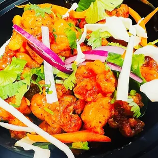 Gobi Manchurian 
(Fried Cauliflower and tossed in chinses Sause)