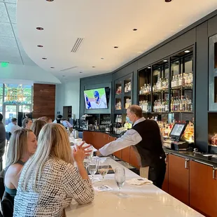 a waiter serving customers