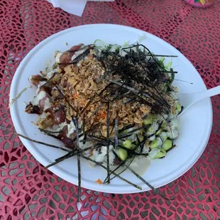 Bowl with white rice, ahi tuna, seaweed salad, edamame, masago, furikake, fried shallots, nori, house fried chili oil