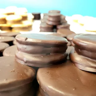 chocolate covered donuts on a table