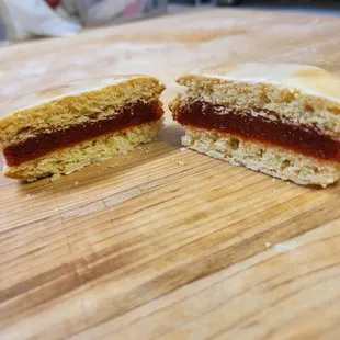 a half eaten sandwich on a cutting board