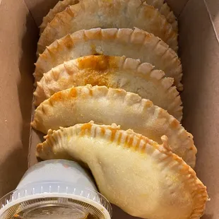 Selection of empanadas to go along with chimichurri