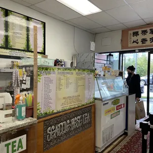 a woman standing at the counter