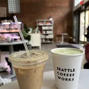 Iced hazelnut latte with regular milk and hot matcha latte with oat milk