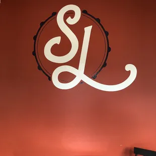 the logo on the wall