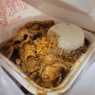 chicken and rice in a styrofoam container