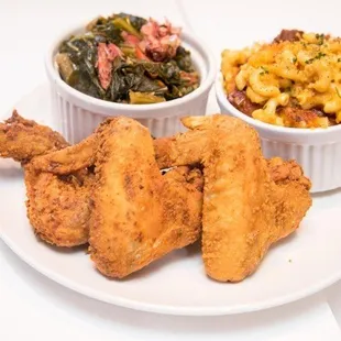 a plate of fried chicken, macaroni and cheese