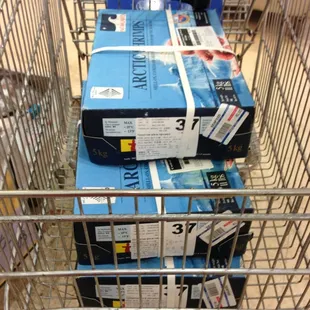 a shopping cart full of packages