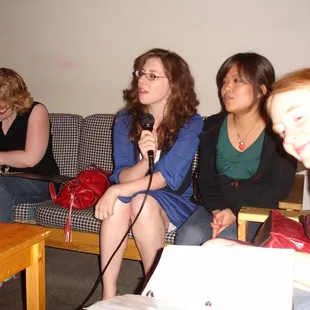 a group of women sitting on a couch