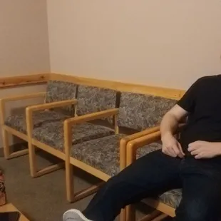 a man sitting in a waiting room