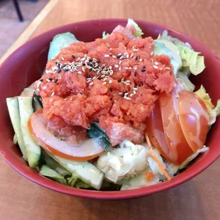 Spicy Tuna bowl :Tuna, lettuce tomato cucumber avocado, sesame ginger dressing, rice. Dressing is lights out.