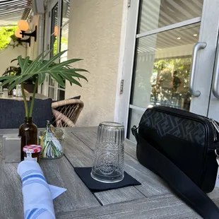  table with a bottle of wine and a towel on it