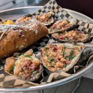 Chargrilled oysters with pork cracklin