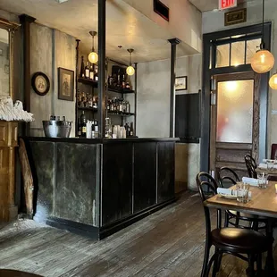  restaurant with a bar and wooden floors