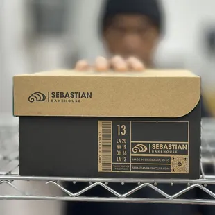 a man holding a box