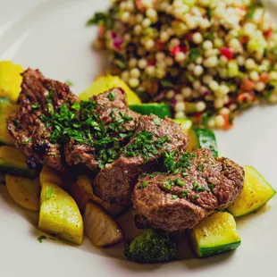 a plate of meat and vegetables