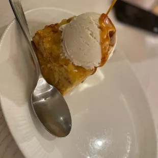 a piece of pie with ice cream on top