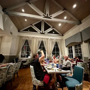 a group of people sitting at a table