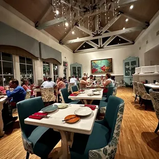 a large dining room filled with people