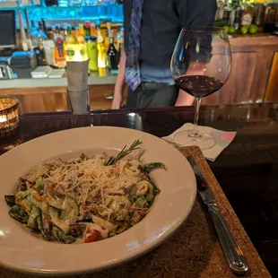 The scratch duck pasta with a nice glass of wine.