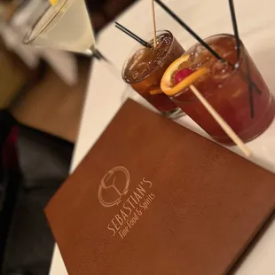 two cocktails on a table