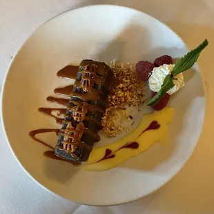 A dessert with chocolate mousse and raspberries on the inside.  It had an unusual name that I don't remember.