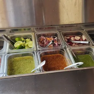 salsa Bar. The salsa on the far left is for chips. And starting from the left side is mild to spicy.