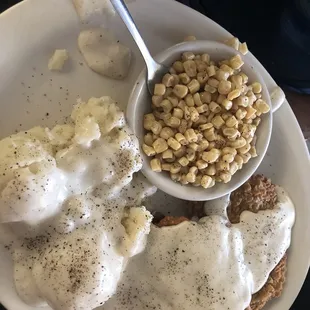 Country fried steak with potatoes and corn