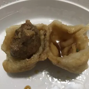Inside of fried dumpling - the outer part is too soggy and flavorless. Meat not much better