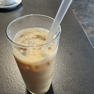 Iced decaf vanilla latte with oat milk