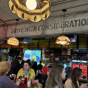 a group of people eating at a restaurant