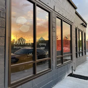 the reflection of the sunset in the windows