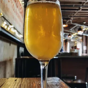 a glass of beer on a table