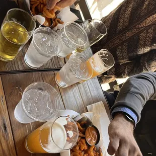 a table full of beer and snacks