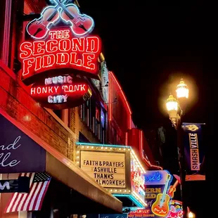 neon signs along a city street