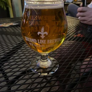 a glass of beer on a table