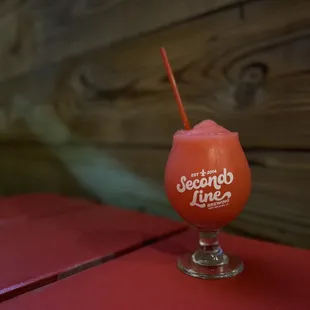 a drink in a glass on a table
