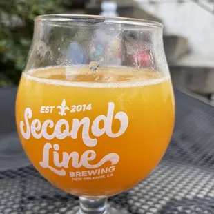 a glass of beer on a table