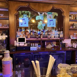 a bar with a variety of drinks