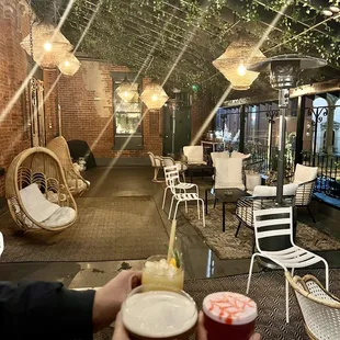 two people toasting with drinks