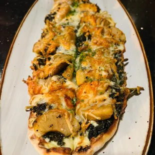 a pizza with mushrooms and cheese